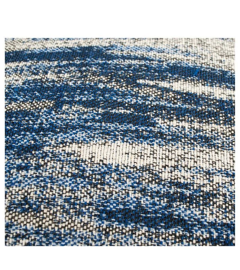 Cojín borlas azul